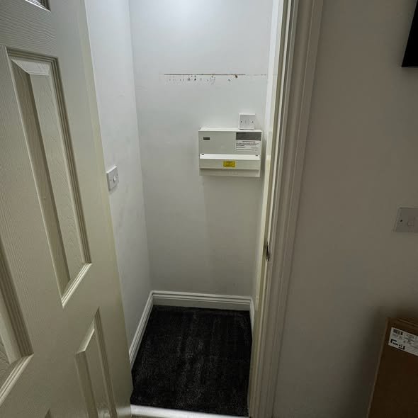 The same cupboard before the work, empty